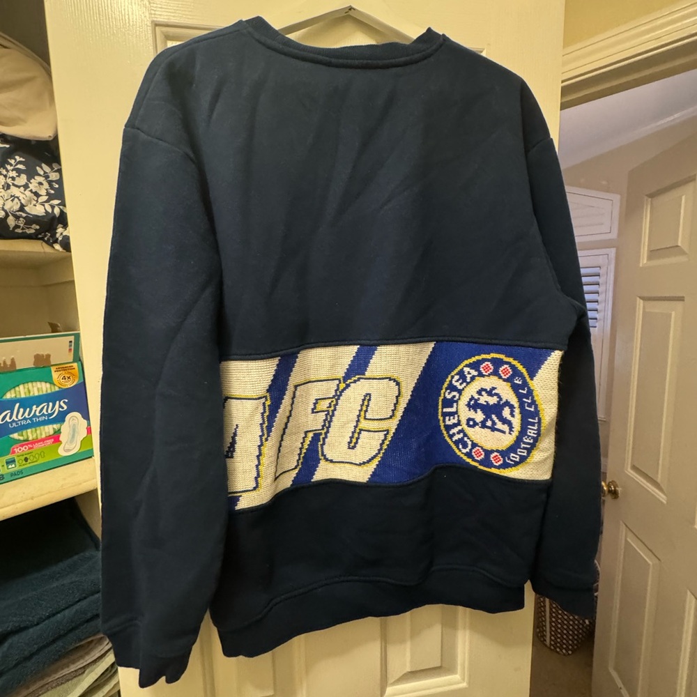 Chelsea Crew Blue Crewneck Sweater with Graphic Design